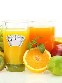 Diet and healthy eating. Fruits, vegetables and juice on white