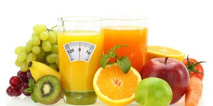 Diet and healthy eating. Fruits, vegetables and juice on white